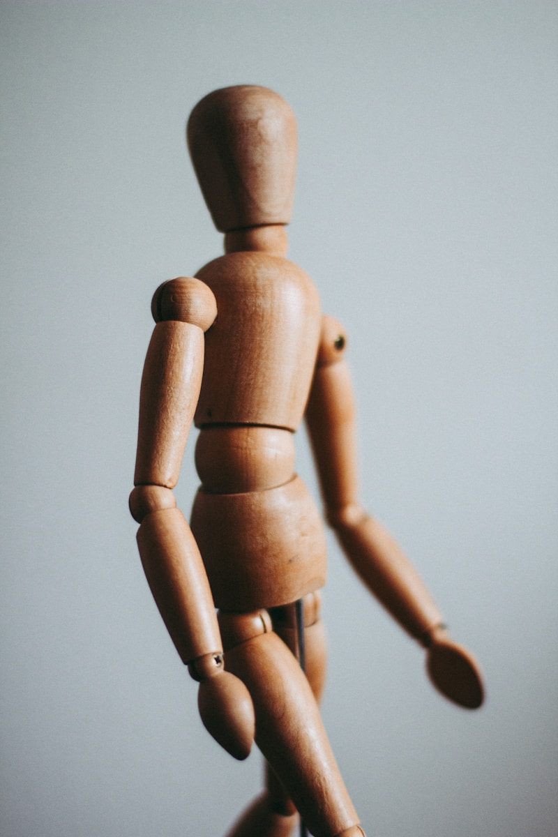 Photo by Kira auf der Heide colse-up photo of brown wooden doll